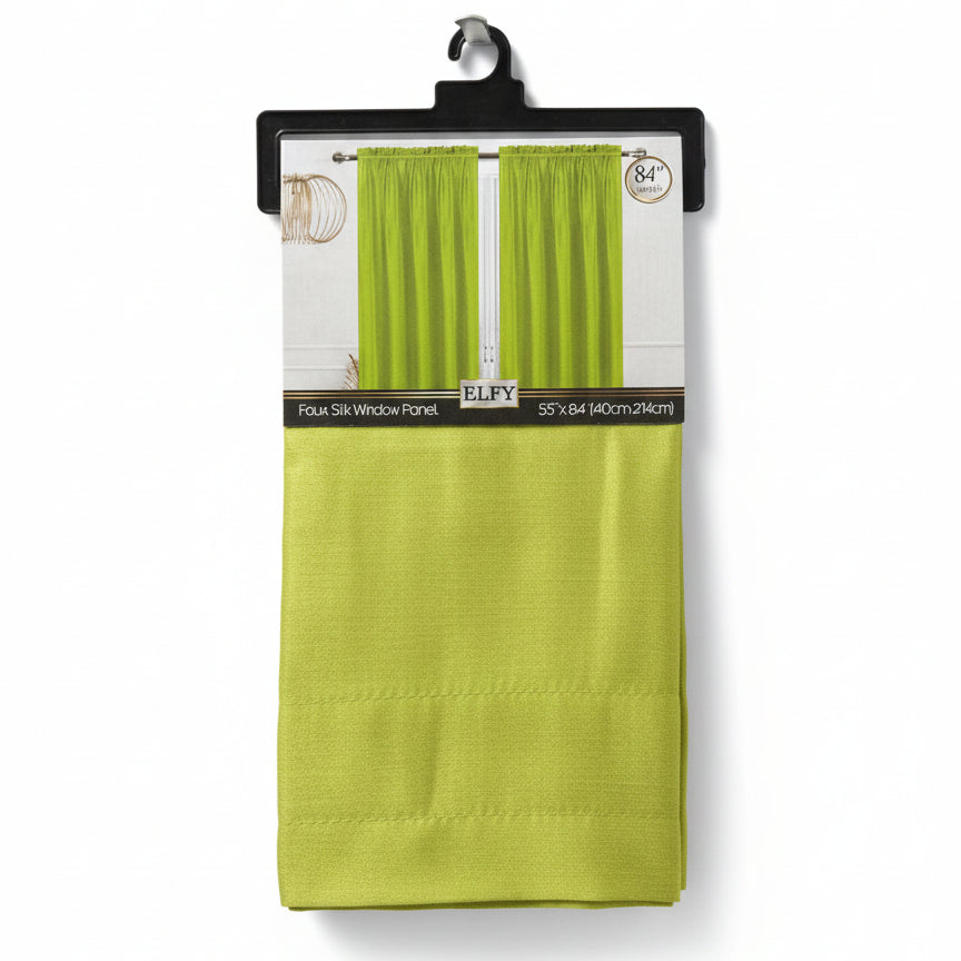 Green fabric swatch on a wooden surface with a label