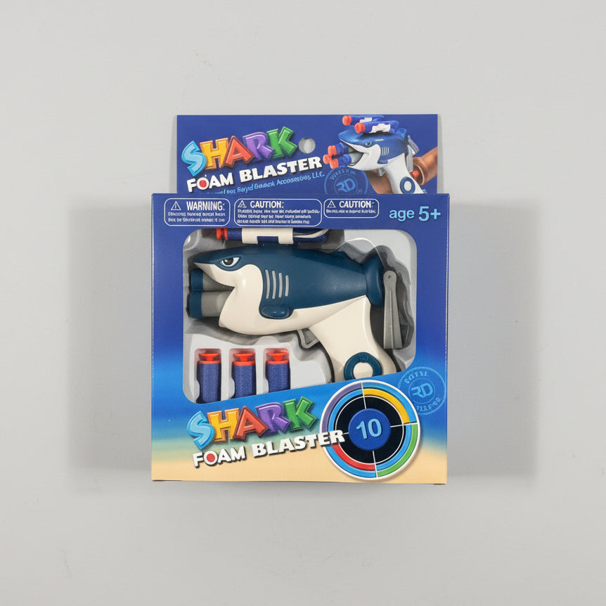 Shark foam master toy packaging on a gray surface