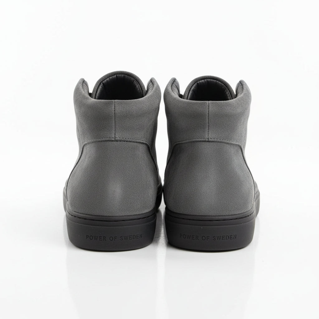 Back view of Tiger of Sweden grey suede high-top sneakers with branding on sole