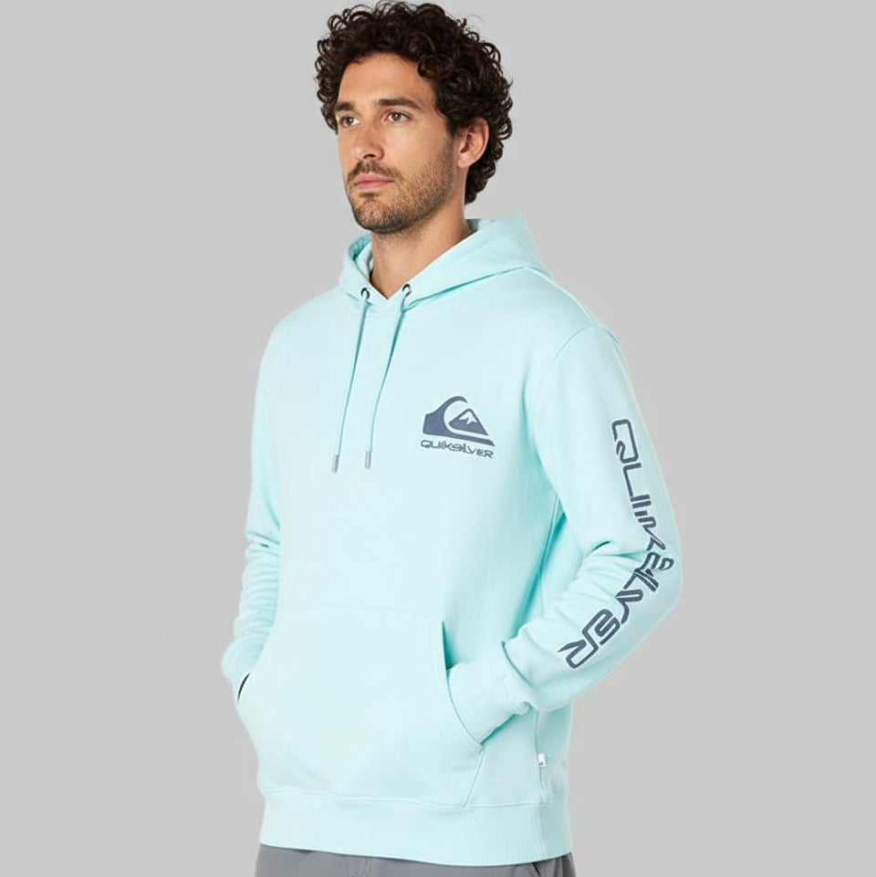Man wearing a light blue hoodie with a brand logo on a white background