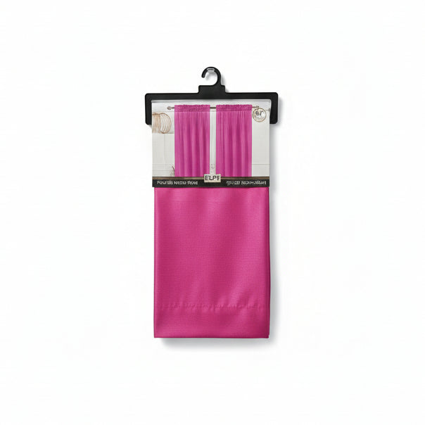 Pink fabric on a wooden surface with a magazine underneath