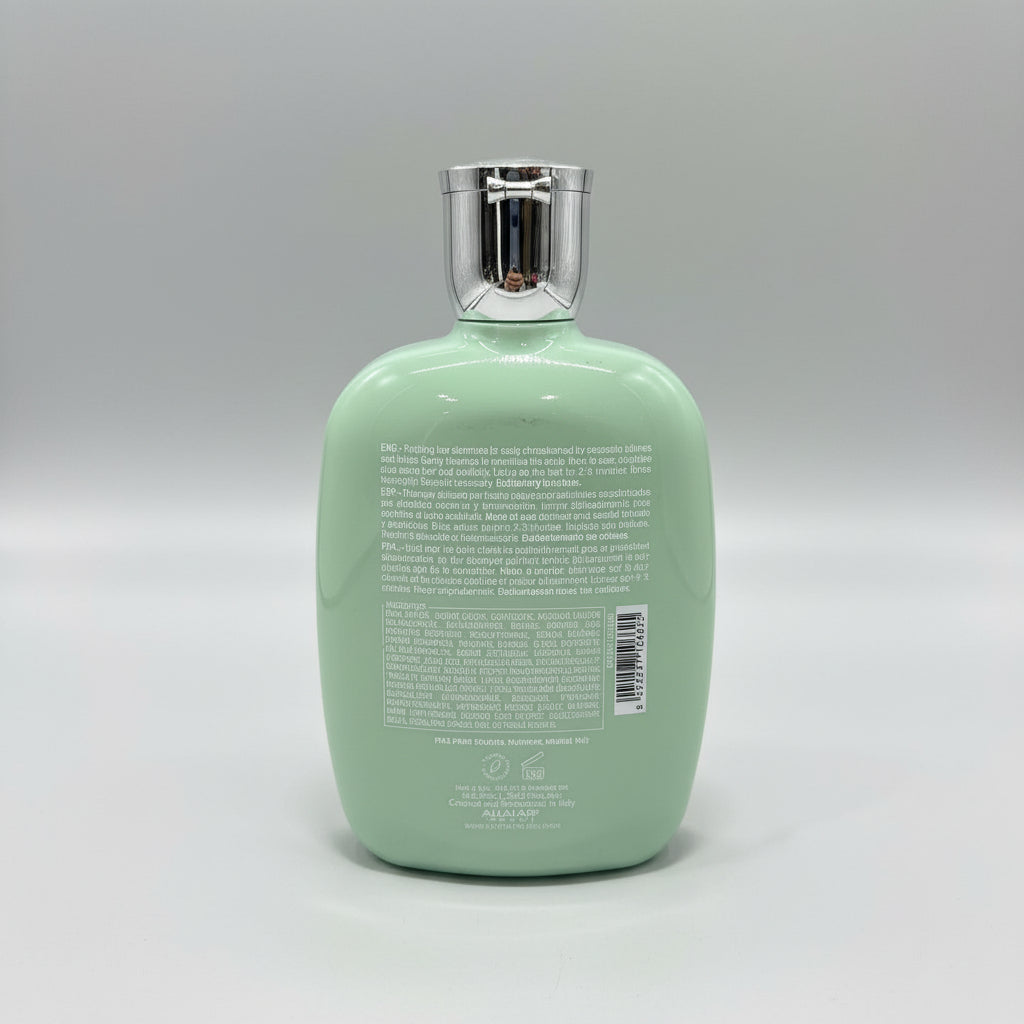 Mint green bottle with label on a red surface