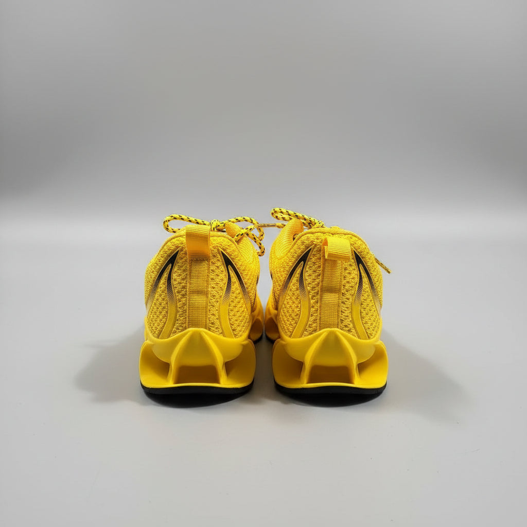 Yellow shoes with black soles on a dark surface
