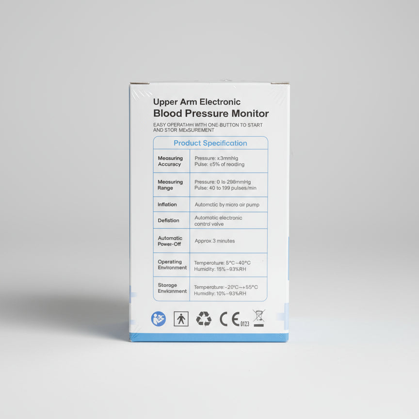Blood pressure monitor packaging with specifications on a dark surface