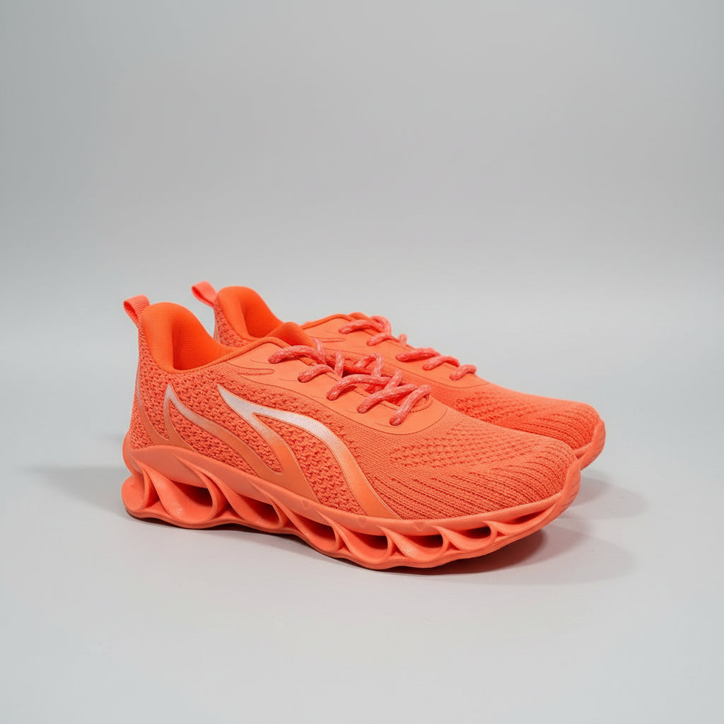 Orange running shoe on a dark surface