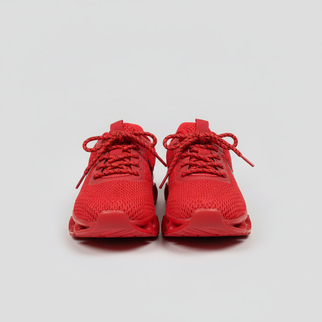 Pair of red shoes on a gray surface