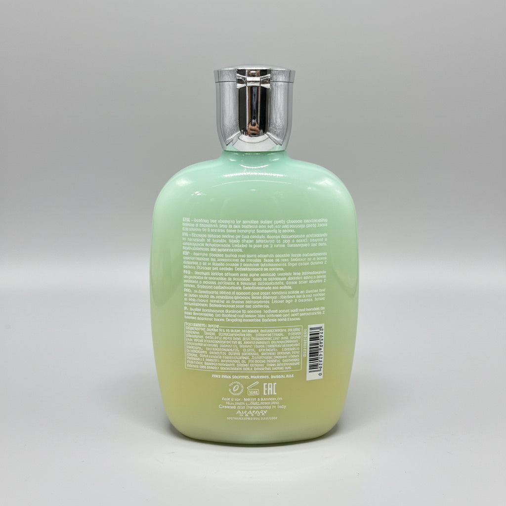 Bottle of shampoo with a visible brand name on a red surface