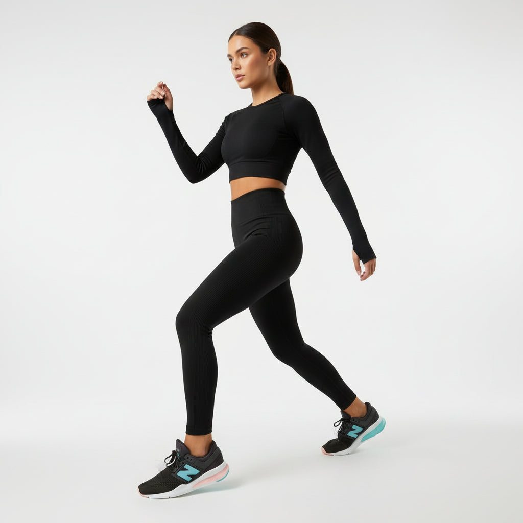 Black running shoes with a blue logo on a cardboard surface