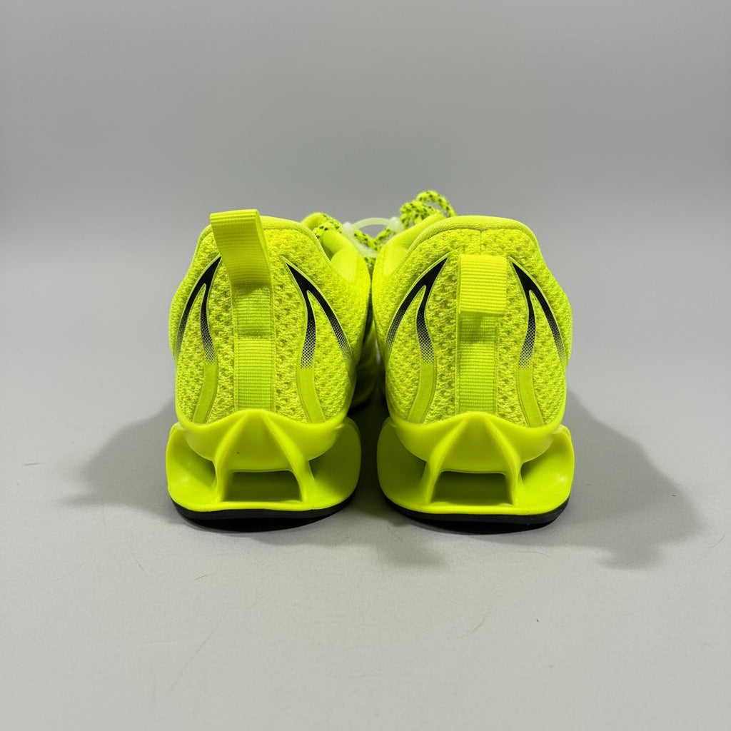Pair of bright green athletic shoes on a dark surface