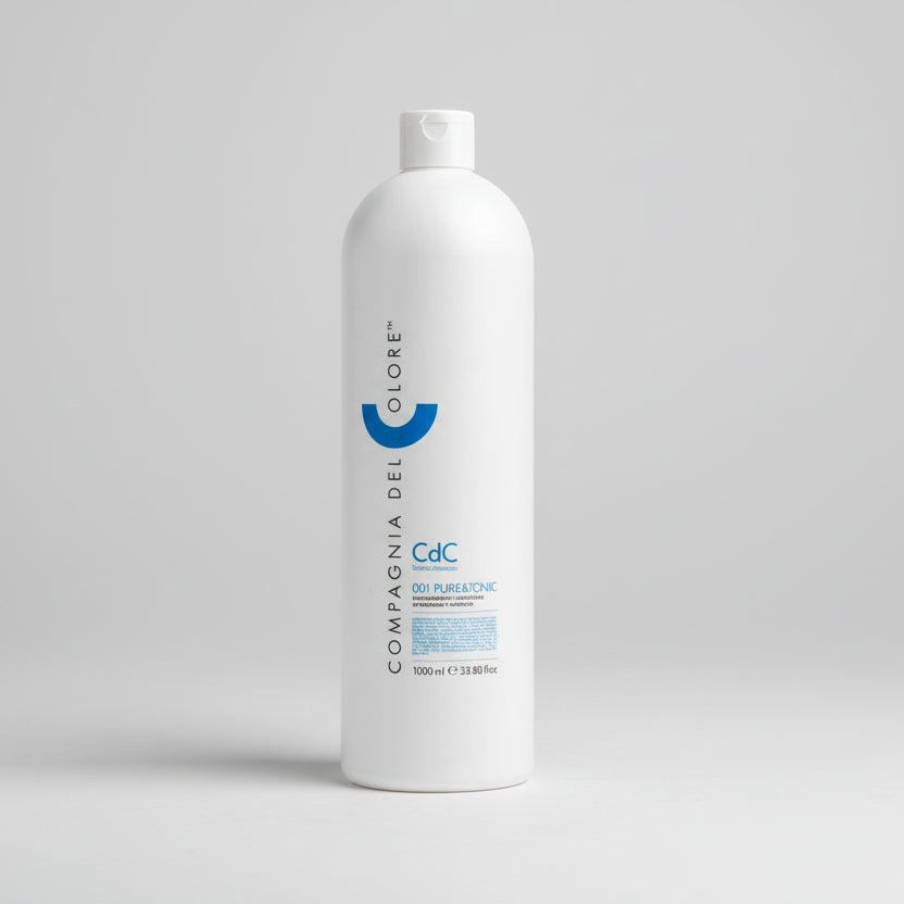 White bottle with branding on a gray surface