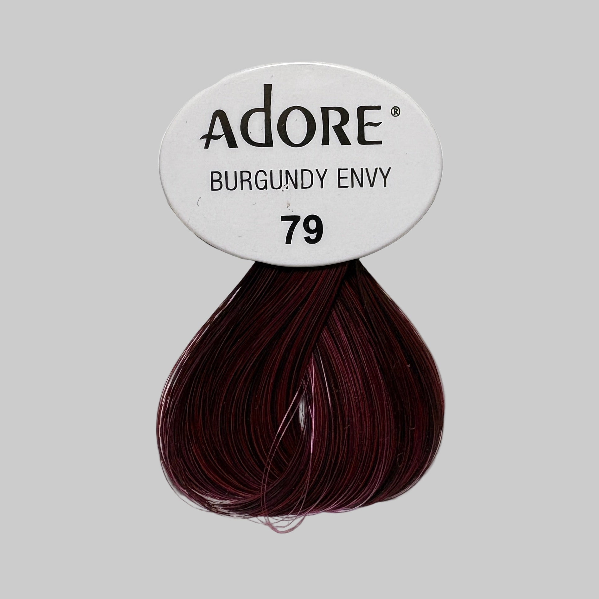 Adore Burgundy Envy hair color pack on a store shelf