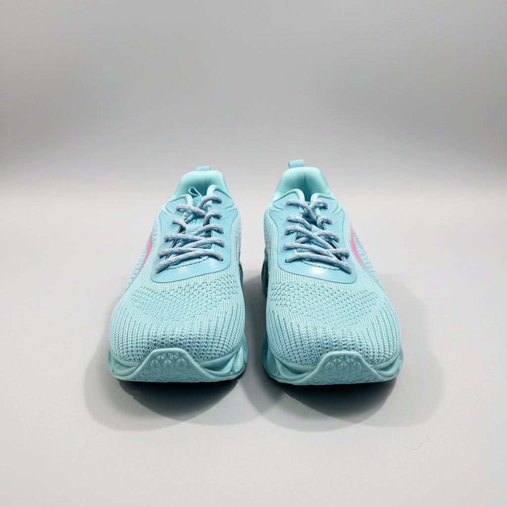 Pair of light blue sneakers on a gray surface