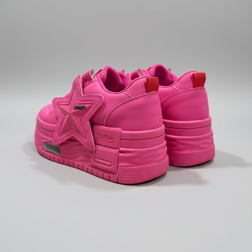 Pink sneakers on a wooden surface with a blurred background