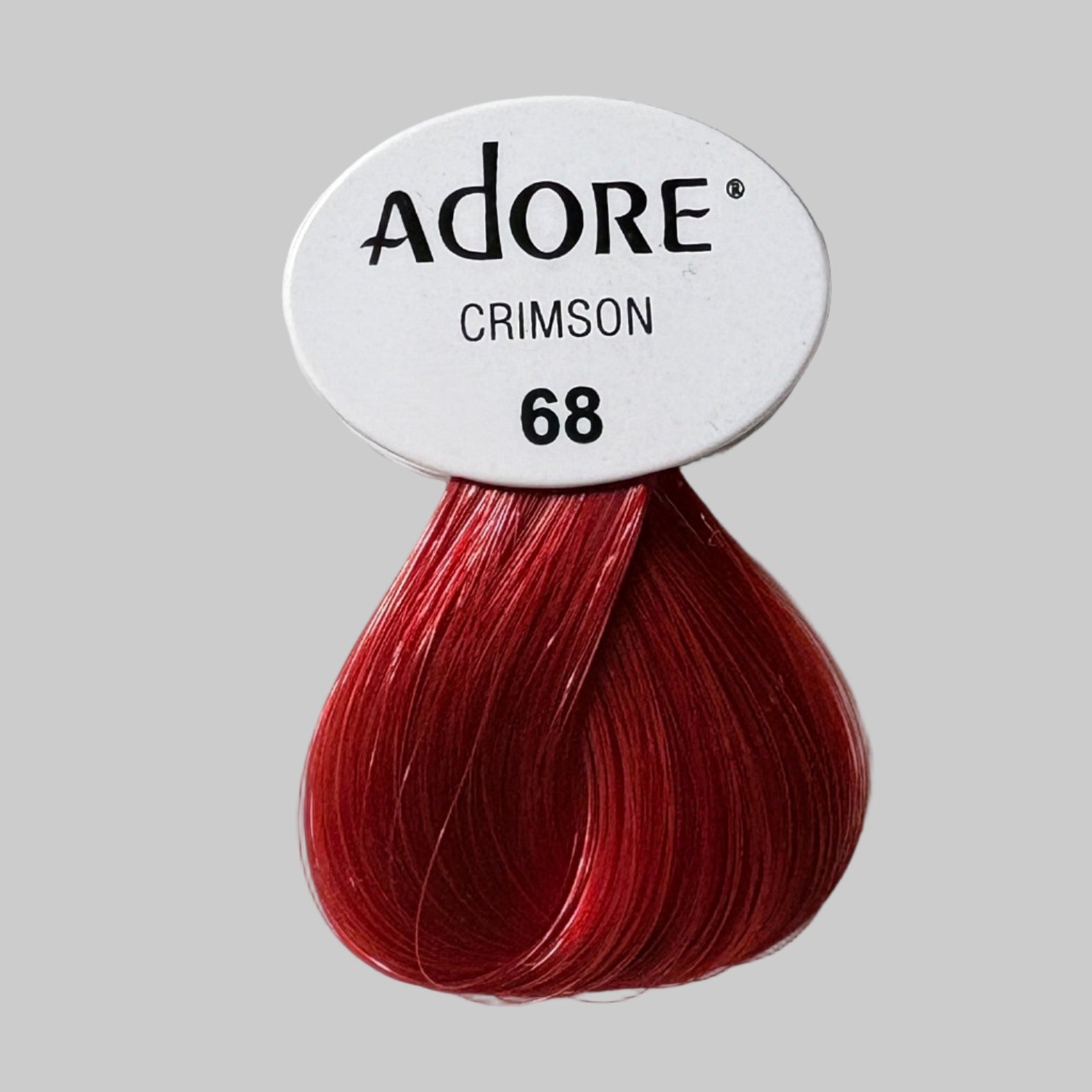 Adore hair color boxes with red hair dye on a shelf