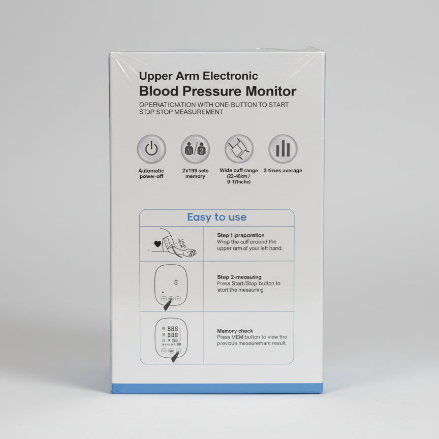 Box of Urban Am Electronic Blood Pressure Monitor on a dark surface