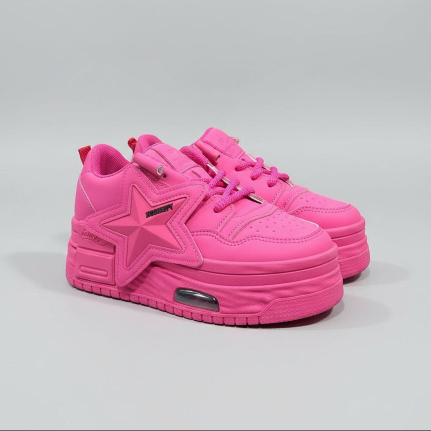 Pink sneaker on a wooden floor with a blurred background