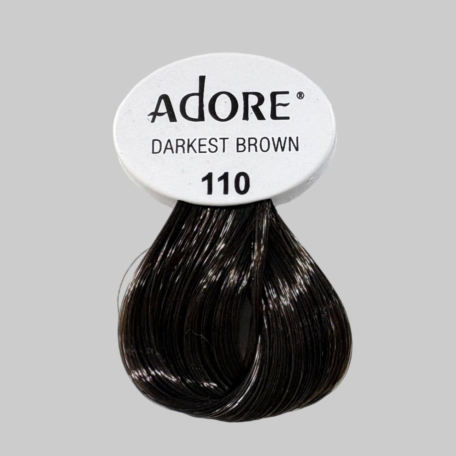 Adore hair color boxes on a store shelf with visible branding.