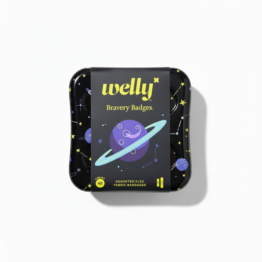 Small black tin with colorful design on a gray surface