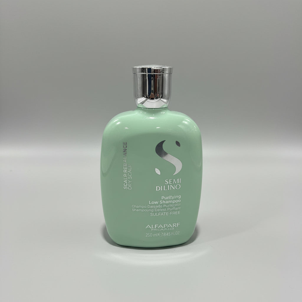 Green hair product bottle on a red surface with a blurred background