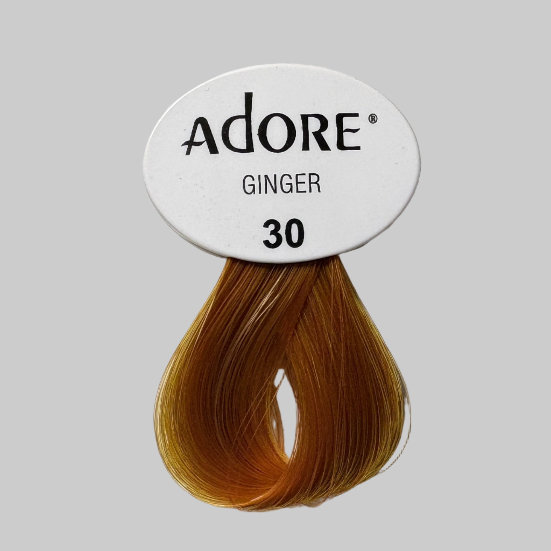 Adore Ginger hair color packaging on a store shelf with other hair color products.