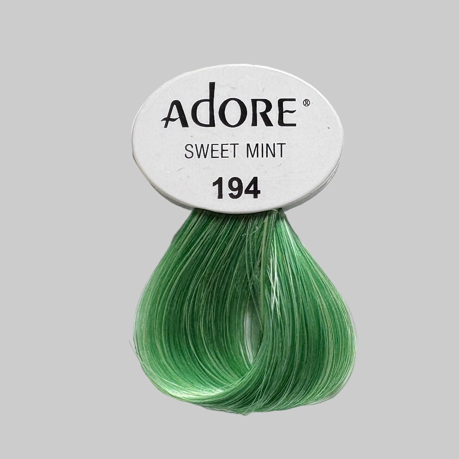 Adore hair color samples and packaging in a store setting