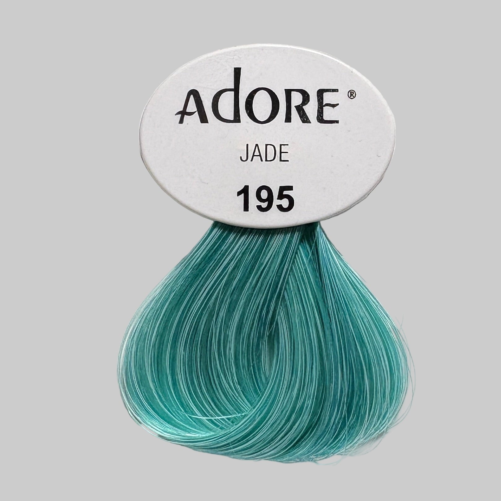 Display of Adore semi-permanent hair color bottles with visible branding.