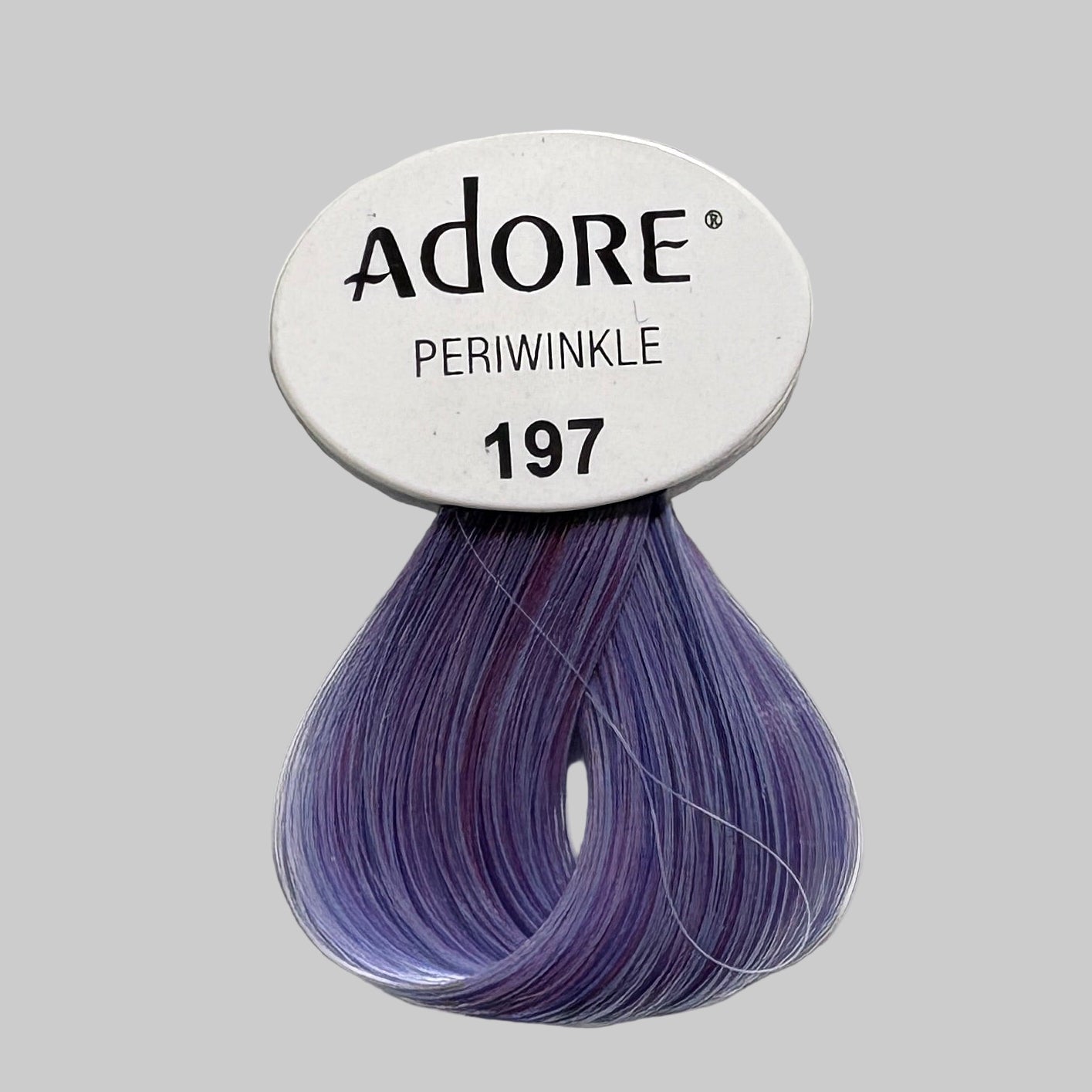 Display of Adore hair color products with blue and purple shades.