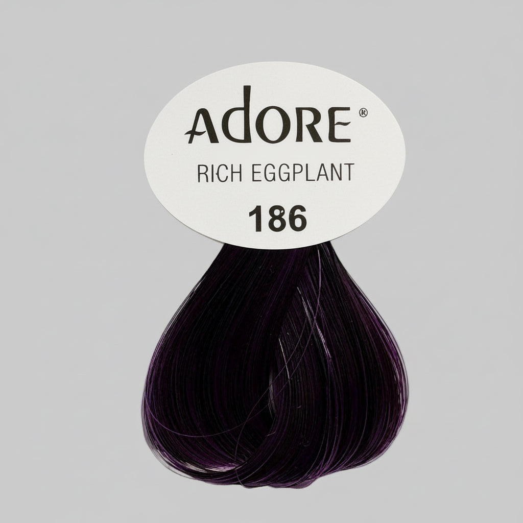 Adore Rich Eggplant hair color swatch on a display with other hair color products.