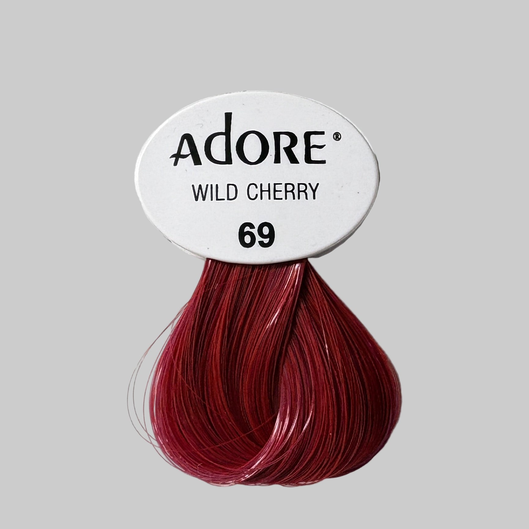 Adore Wild Cherry hair color packaging with visible product and brand name.