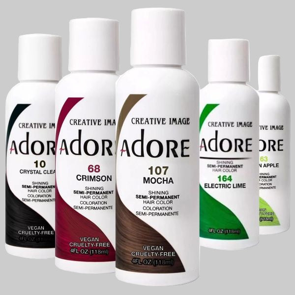 Set of Adore hair color bottles with various shades on a white background