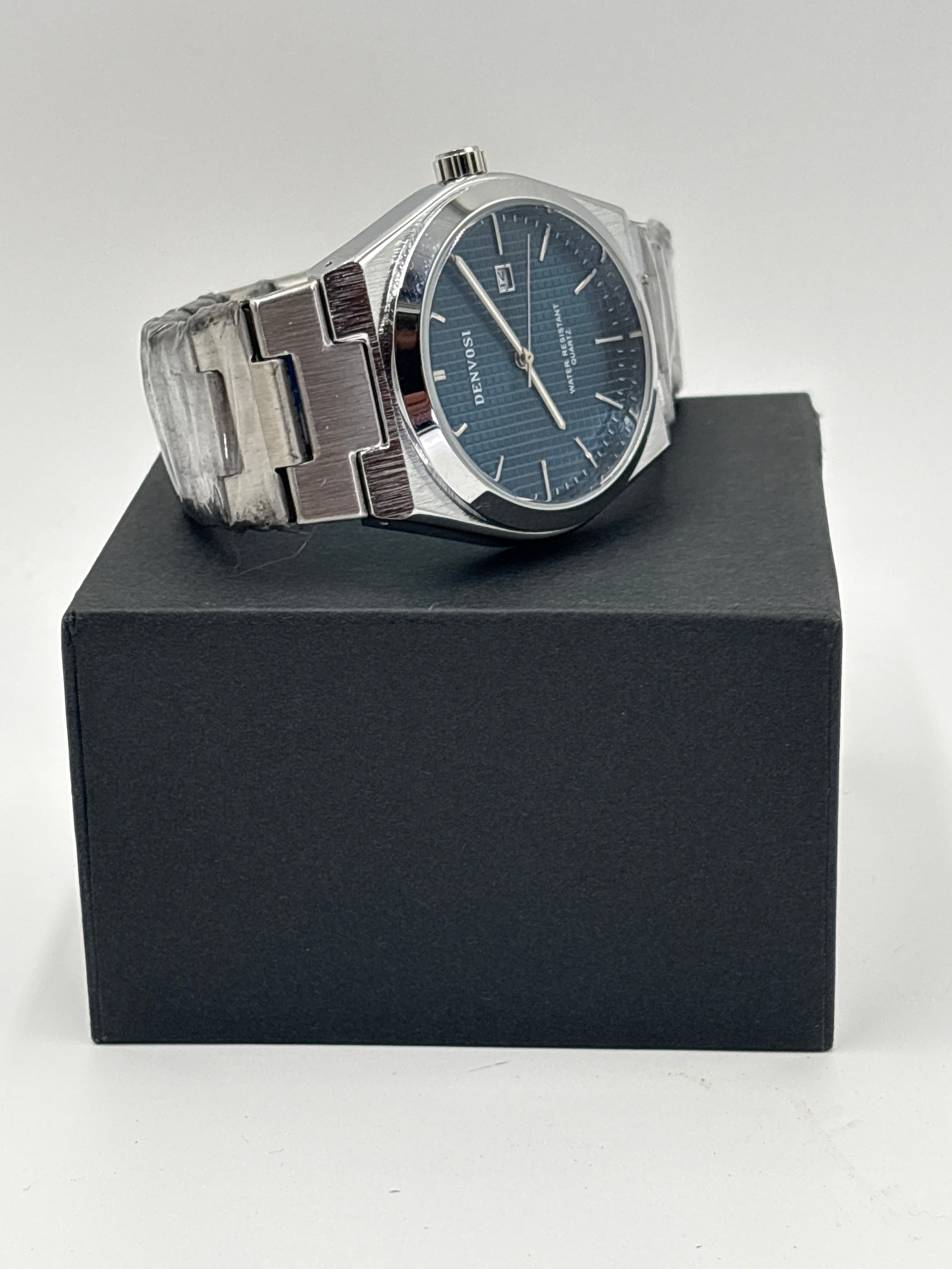 Denvosi men's chrome watch with blue dial and silver stainless steel band on black box