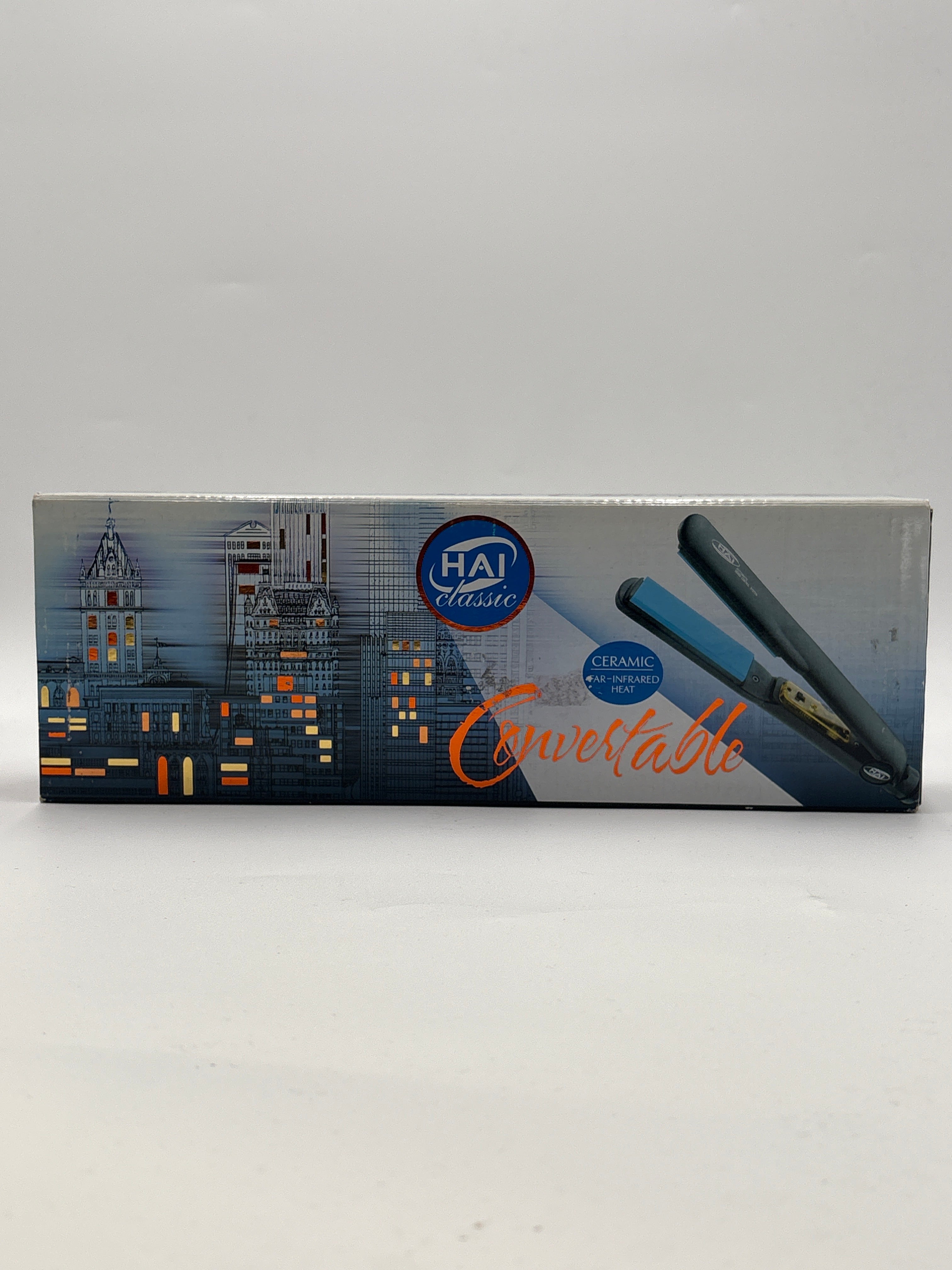 Hai Classic Convertible Ceramic Hair Iron packaging showing flat iron with ceramic plates and cityscape design