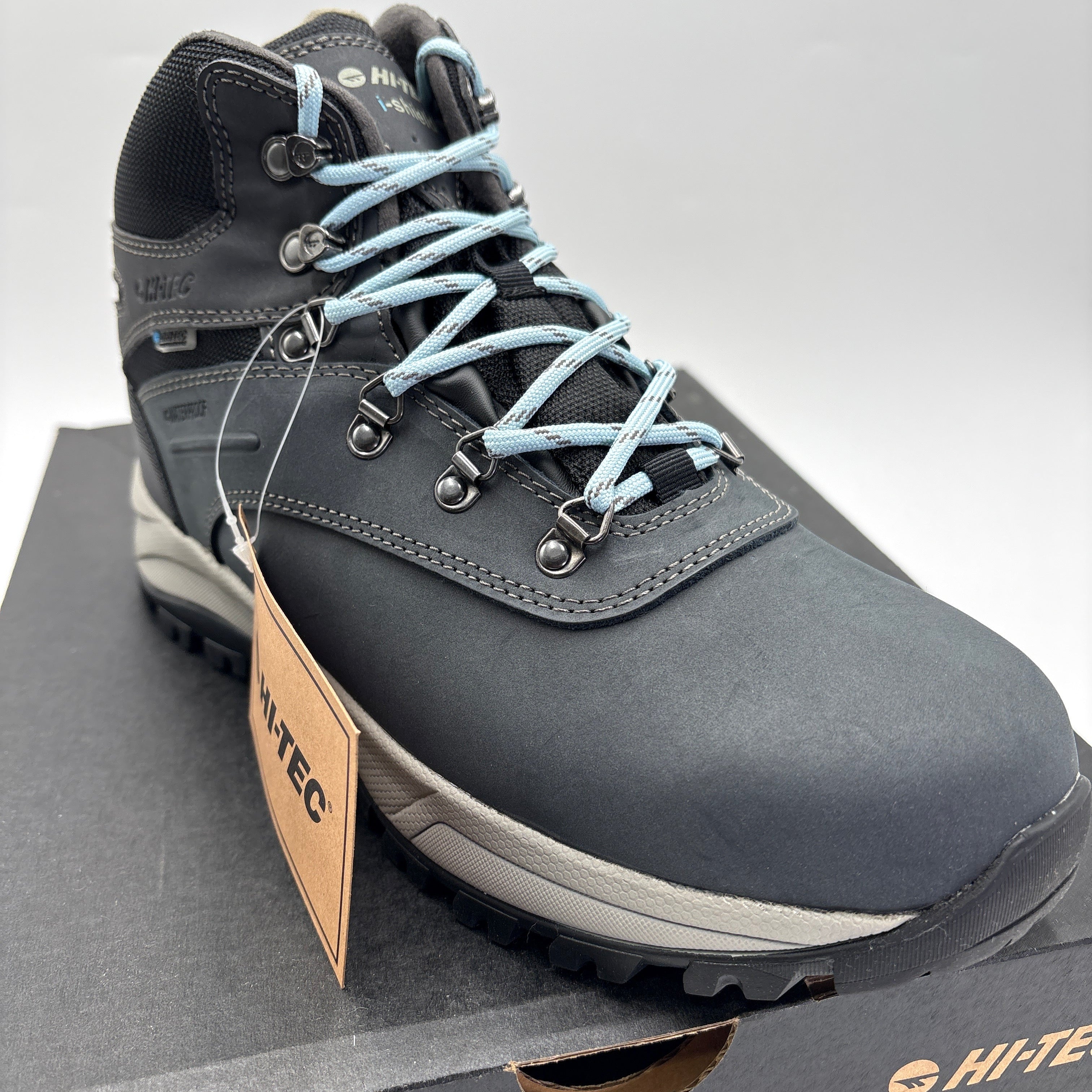 HI-TEC Altitude VI boots for women in black with light blue laces displayed on a HI-TEC branded shoebox