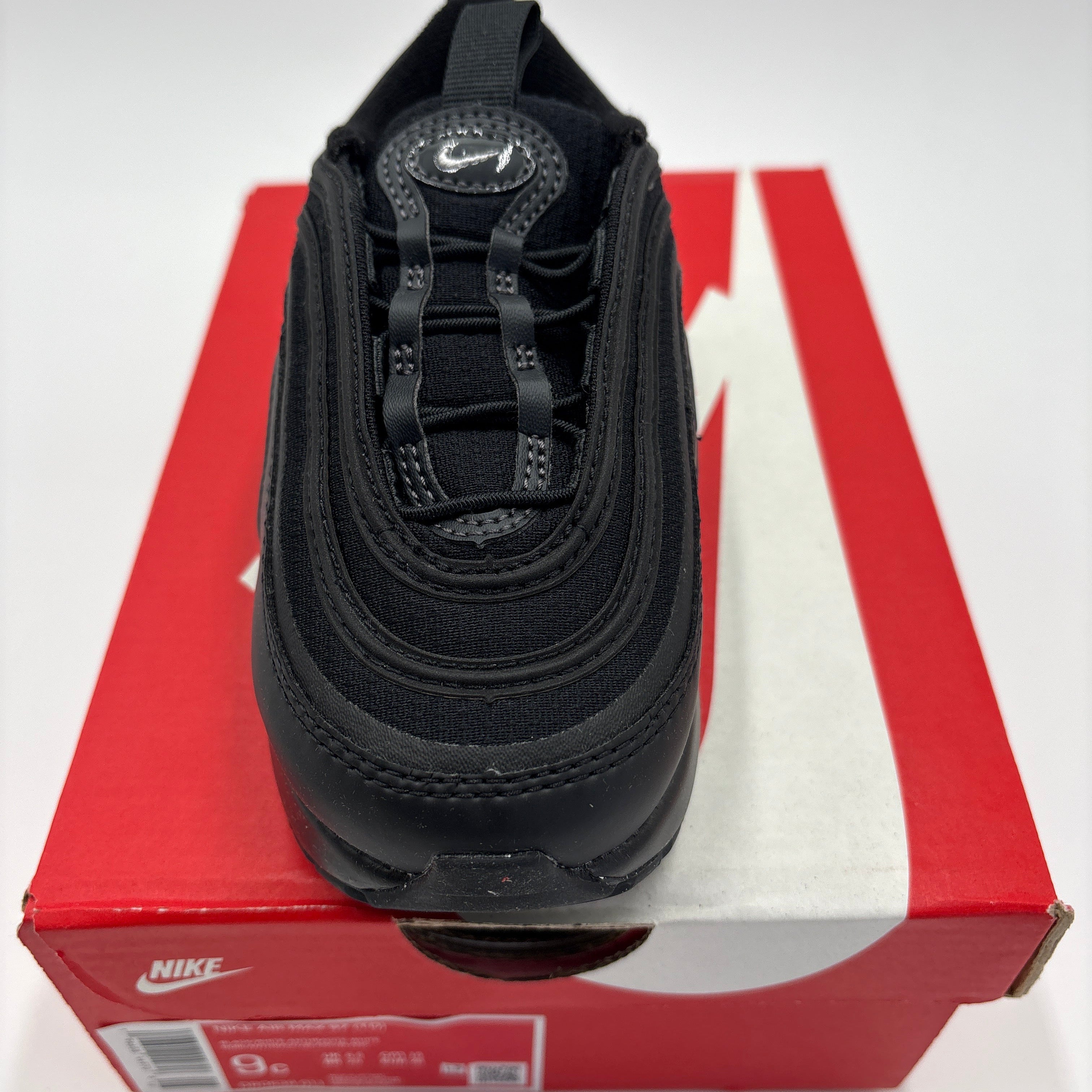 Black Nike Air Max 97 TD for toddlers on red and white Nike shoe box