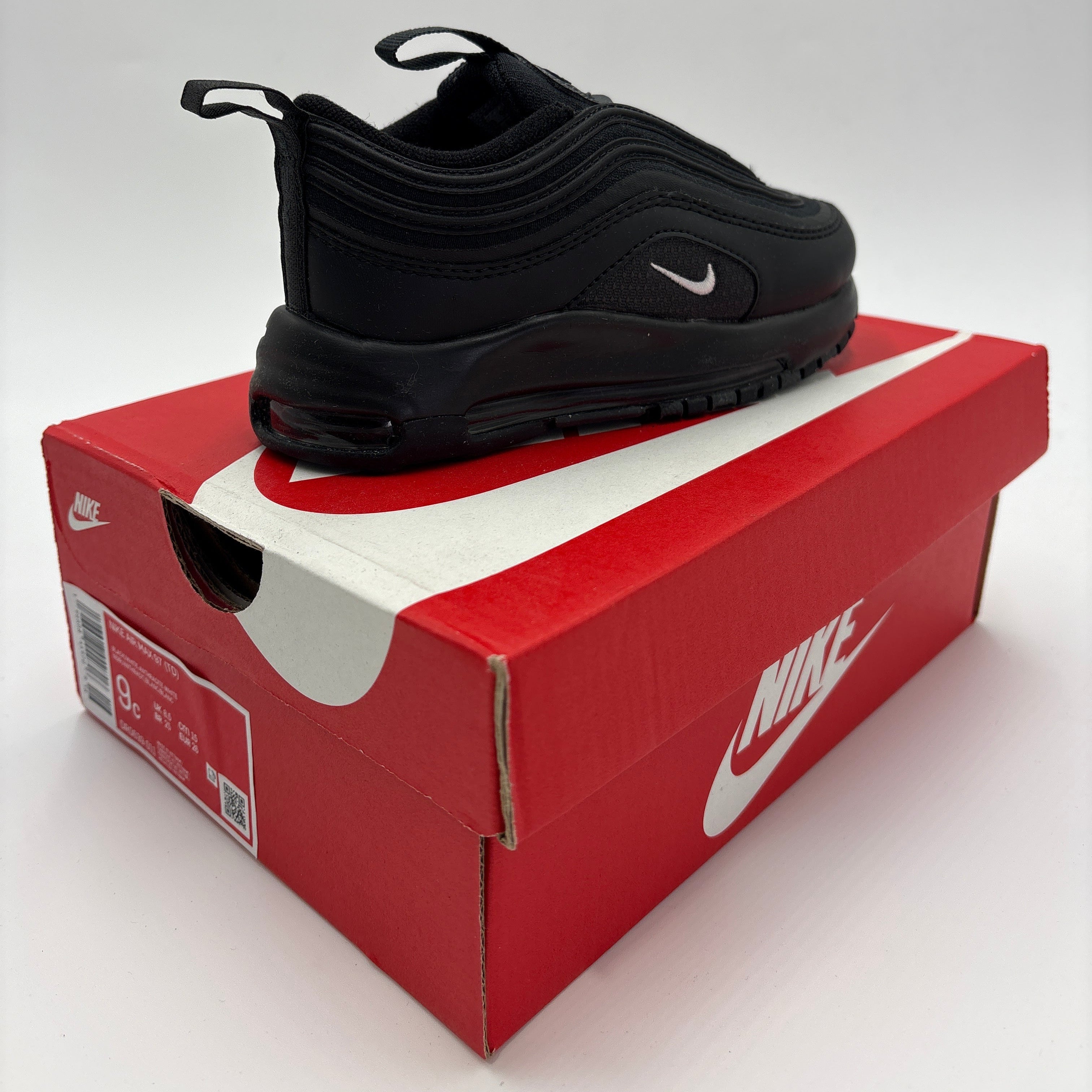 Black Air Max 97 TD for toddlers displayed on a red Nike shoe box from DOLLARS UNIVERSE LLC