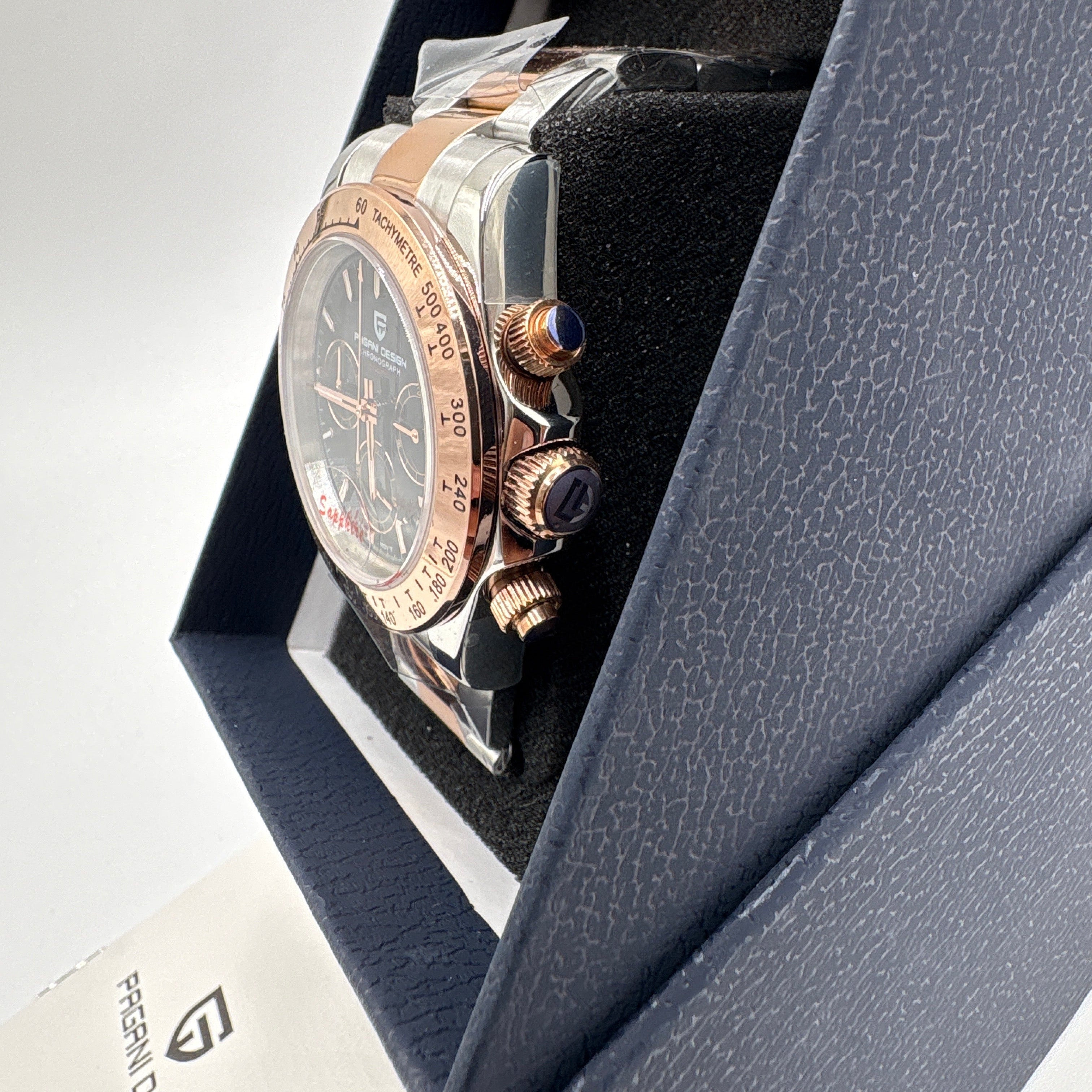 Pagani Design chrome gold watch with black dial and chronograph features in a black presentation box
