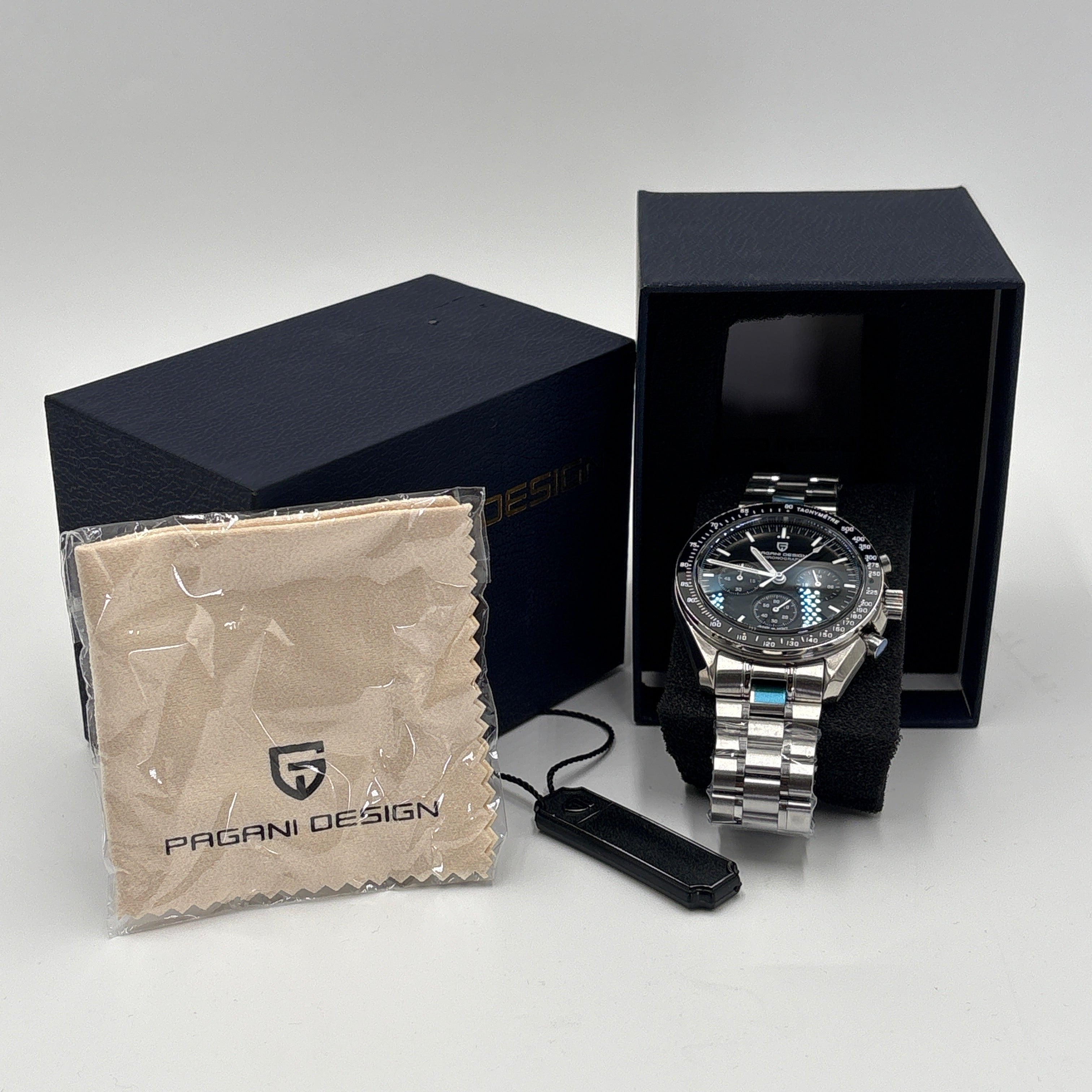 Pagani Design men’s watch with stainless steel band displayed in black box with cleaning cloth and tag