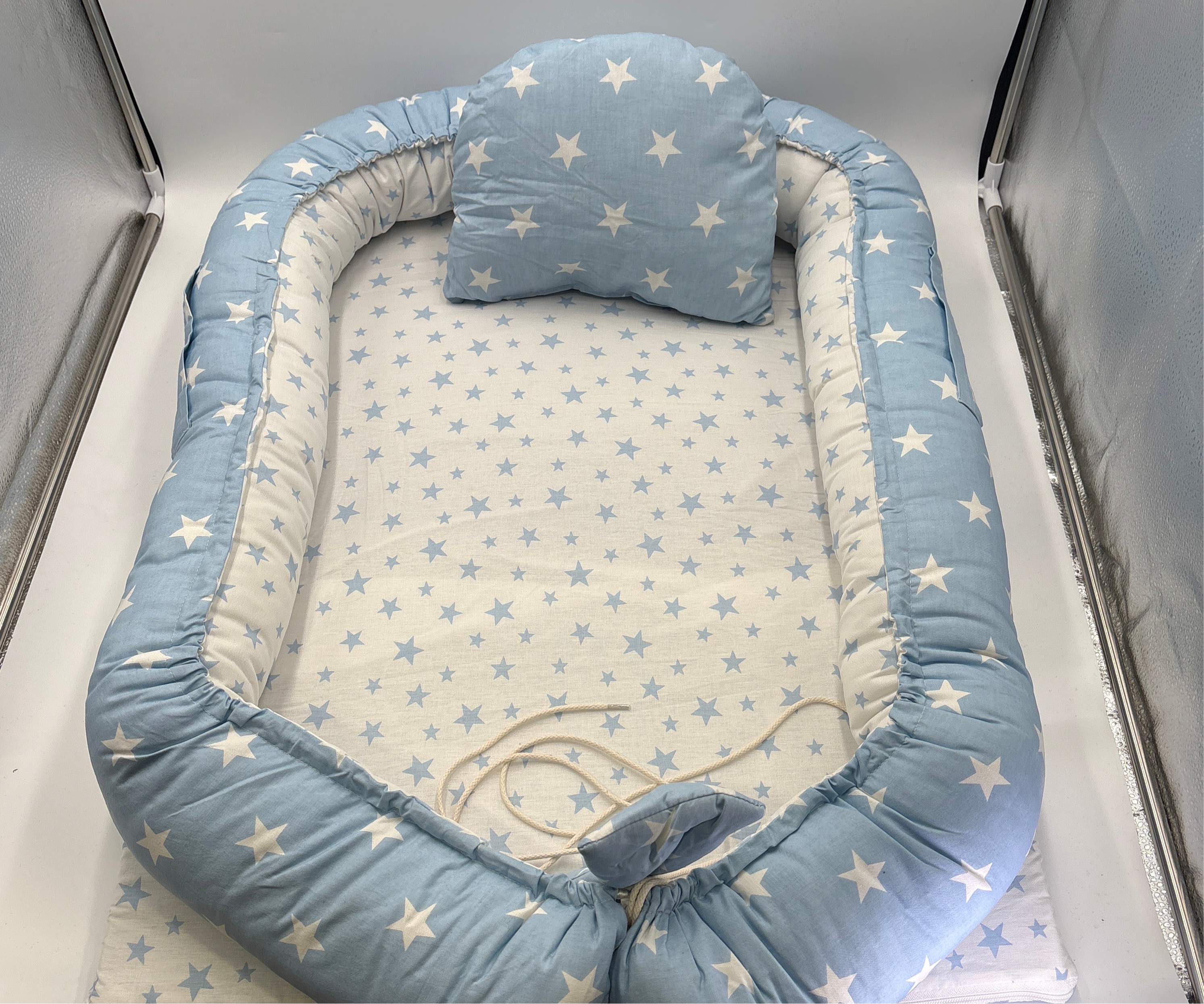 Portable baby lounger with washable cover in blue and white star pattern from DOLLARS UNIVERSE LLC