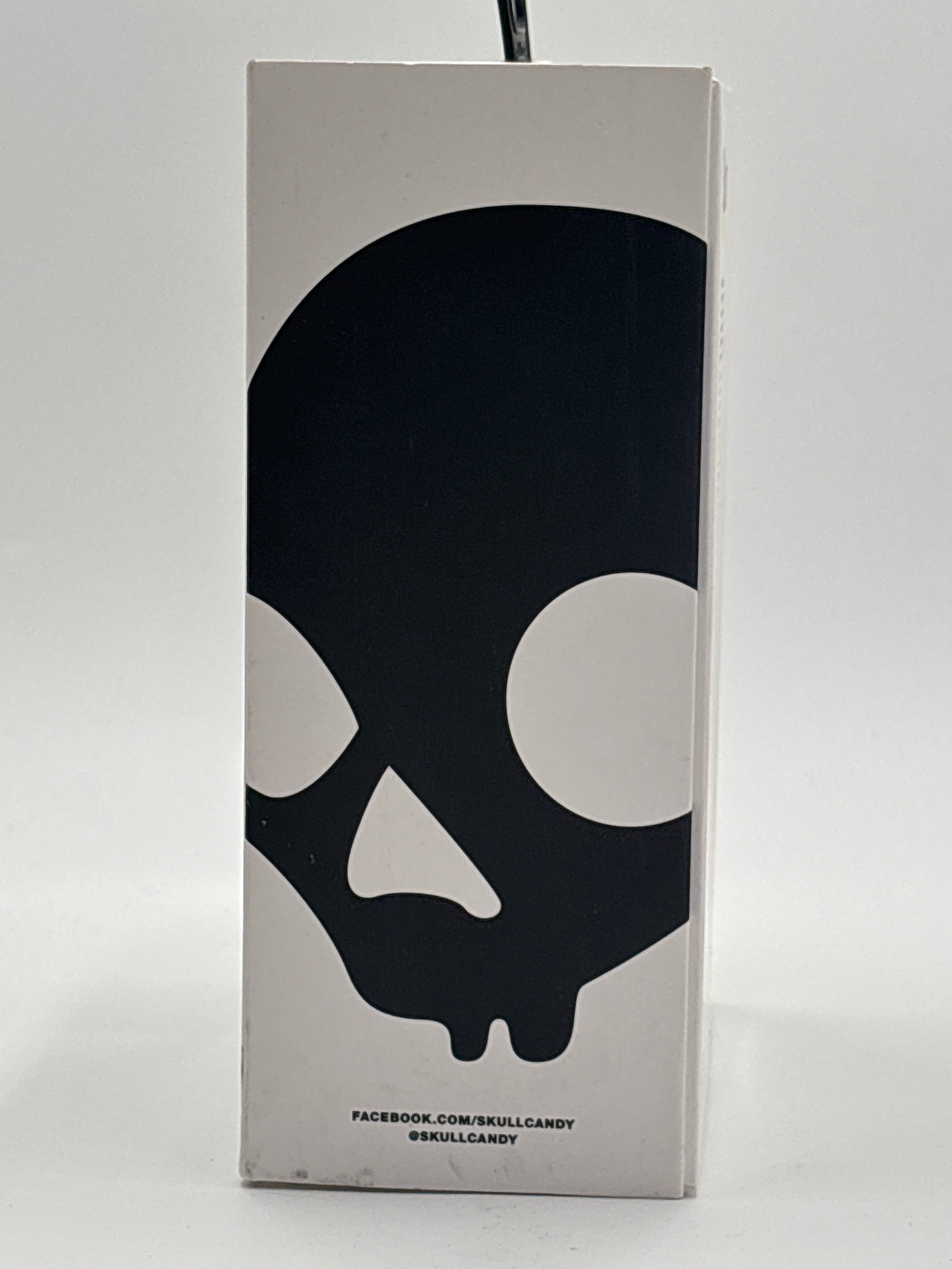 Skullcandy Navigator wired headphones packaging with large black skull logo on white box