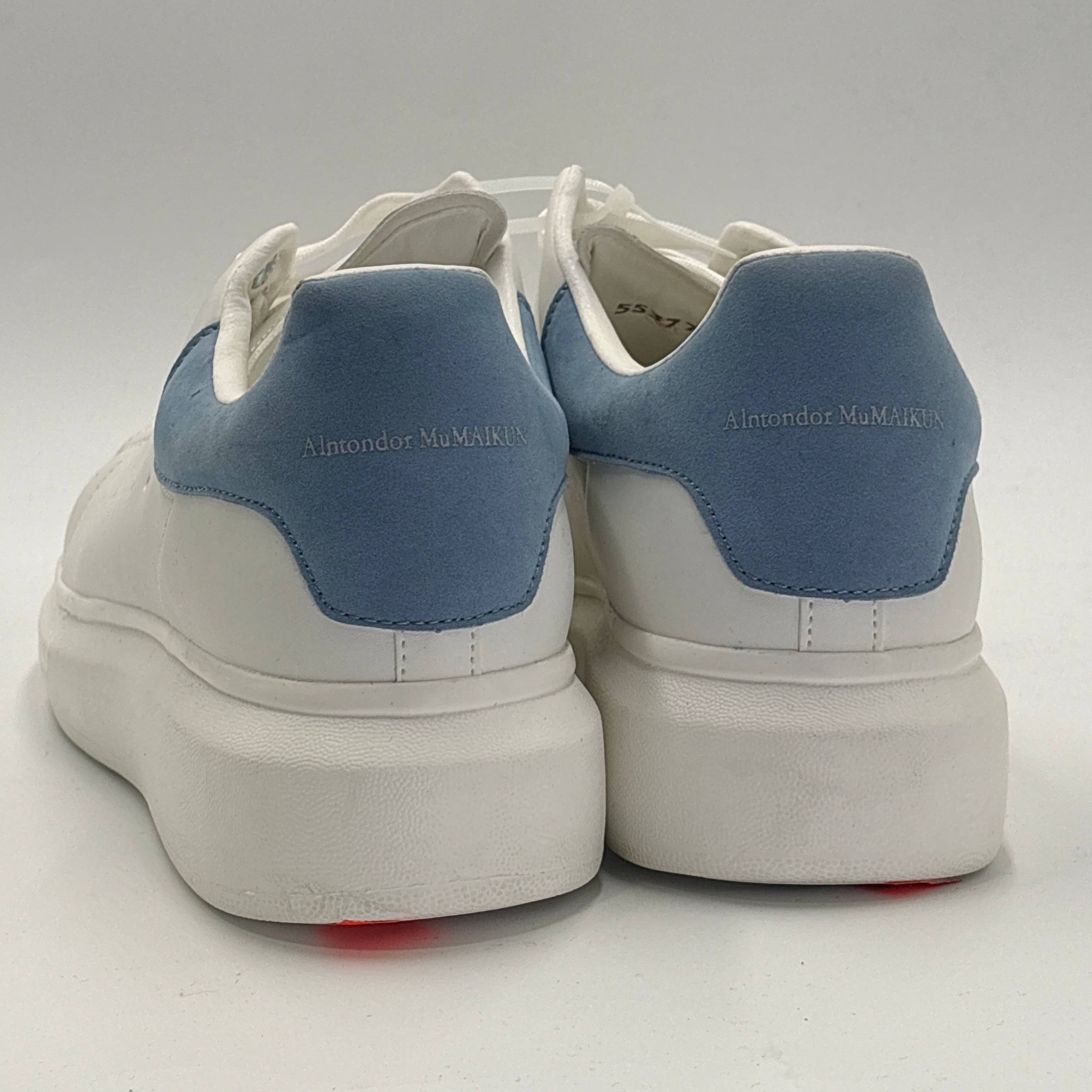 White and blue casual sneakers with thick white soles and blue heel accents from DOLLARS UNIVERSE LLC