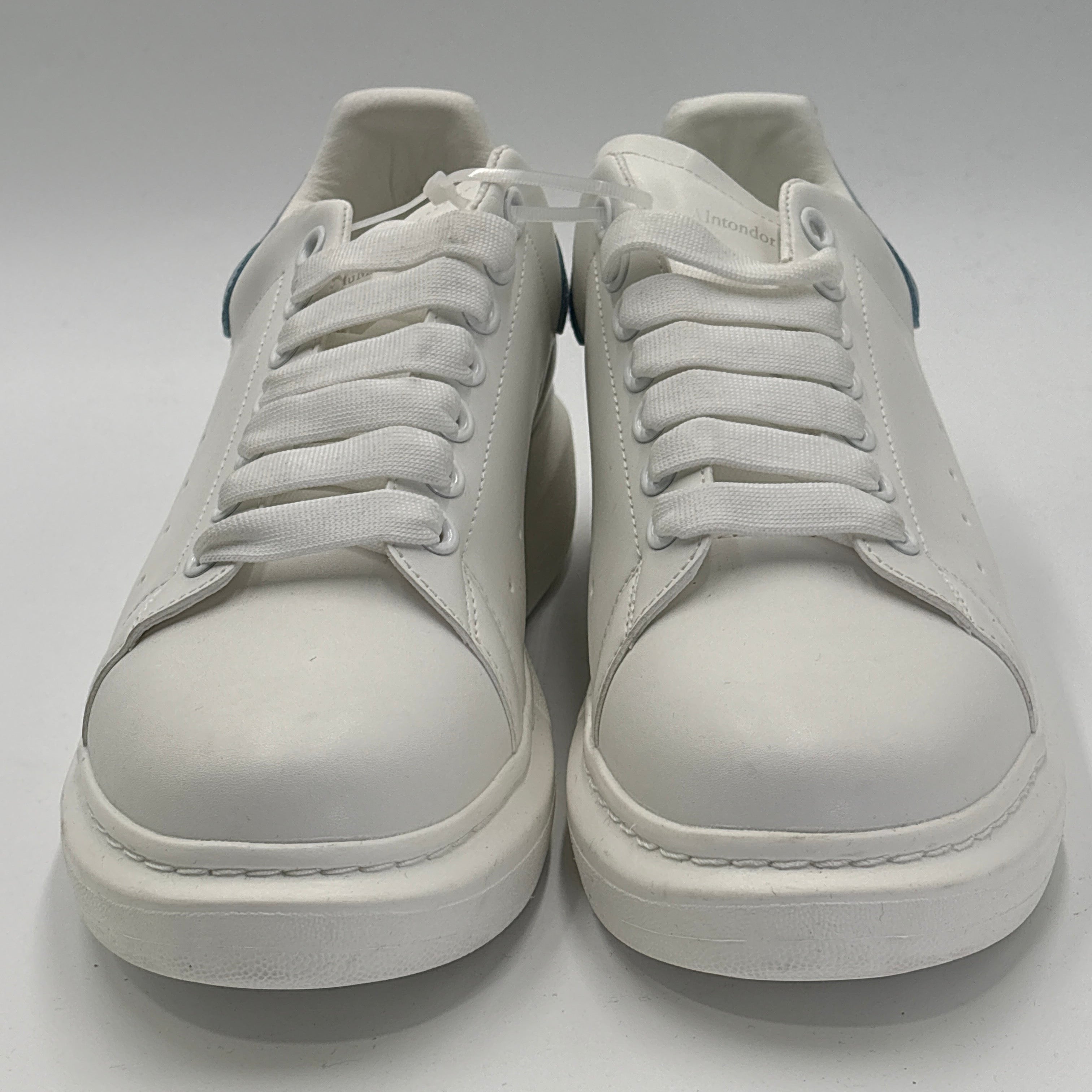 White and blue casual sneakers with white laces and thick sole from DOLLARS UNIVERSE LLC